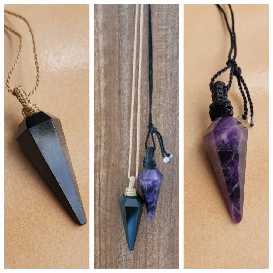 Black and purple faceted Neutralised Crystals on macrame cords, displayed on brown and wood surfaces.